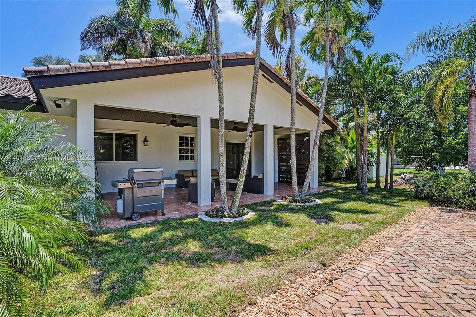 15971 Southwest 252nd Street Homestead, FL 33031 - Photo 57 of 92 a view of a house with backyard porch and sitting area