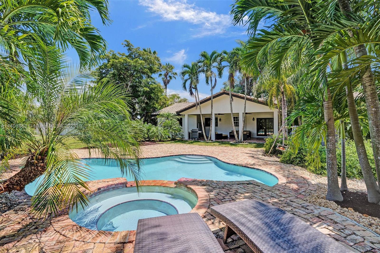 15971 Southwest 252nd Street Homestead, FL 33031 - Photo 58 of 92 a front view of a house with swimming pool