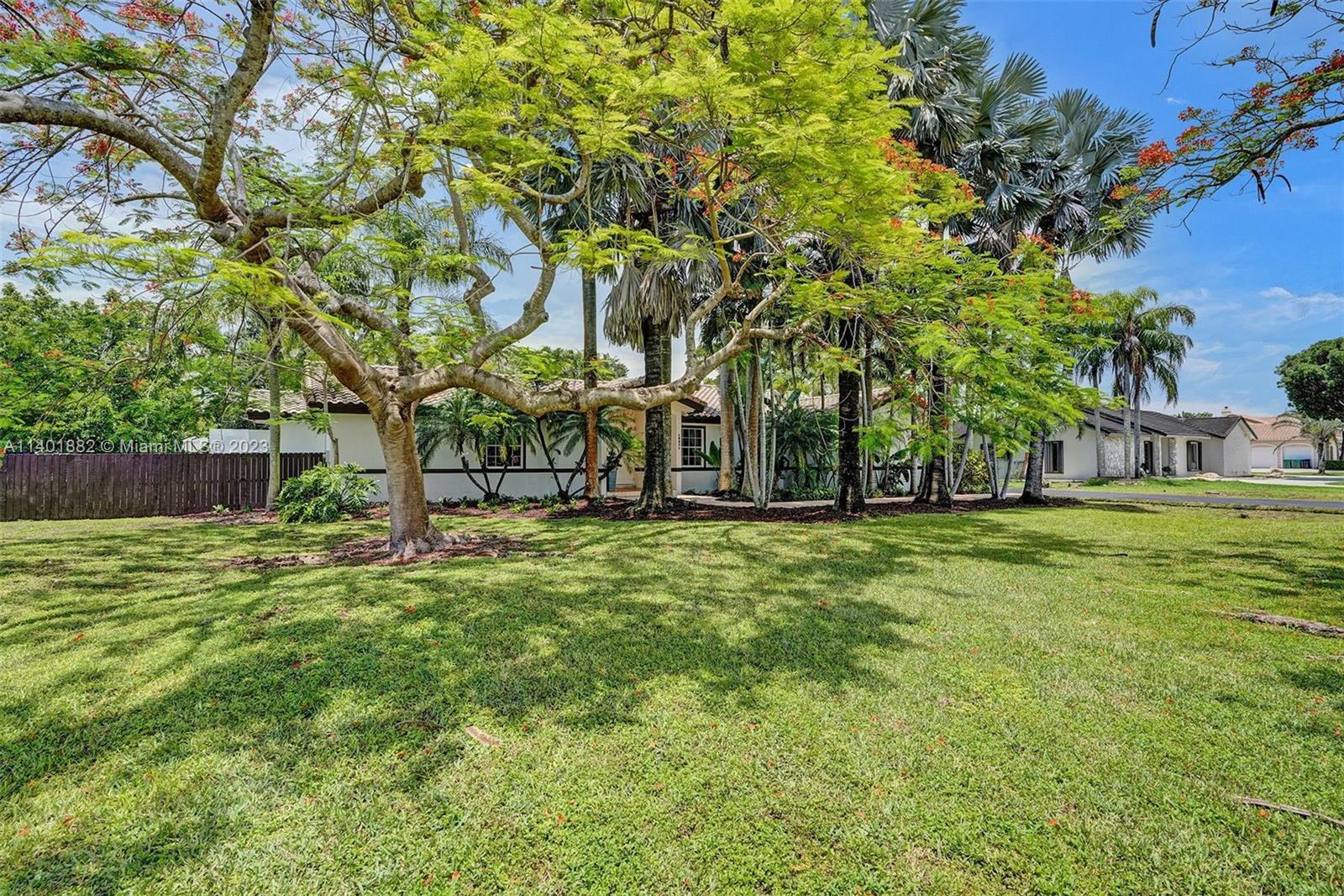 15971 Southwest 252nd Street Homestead, FL 33031 - Photo 6 of 92 a view of a house with a backyard