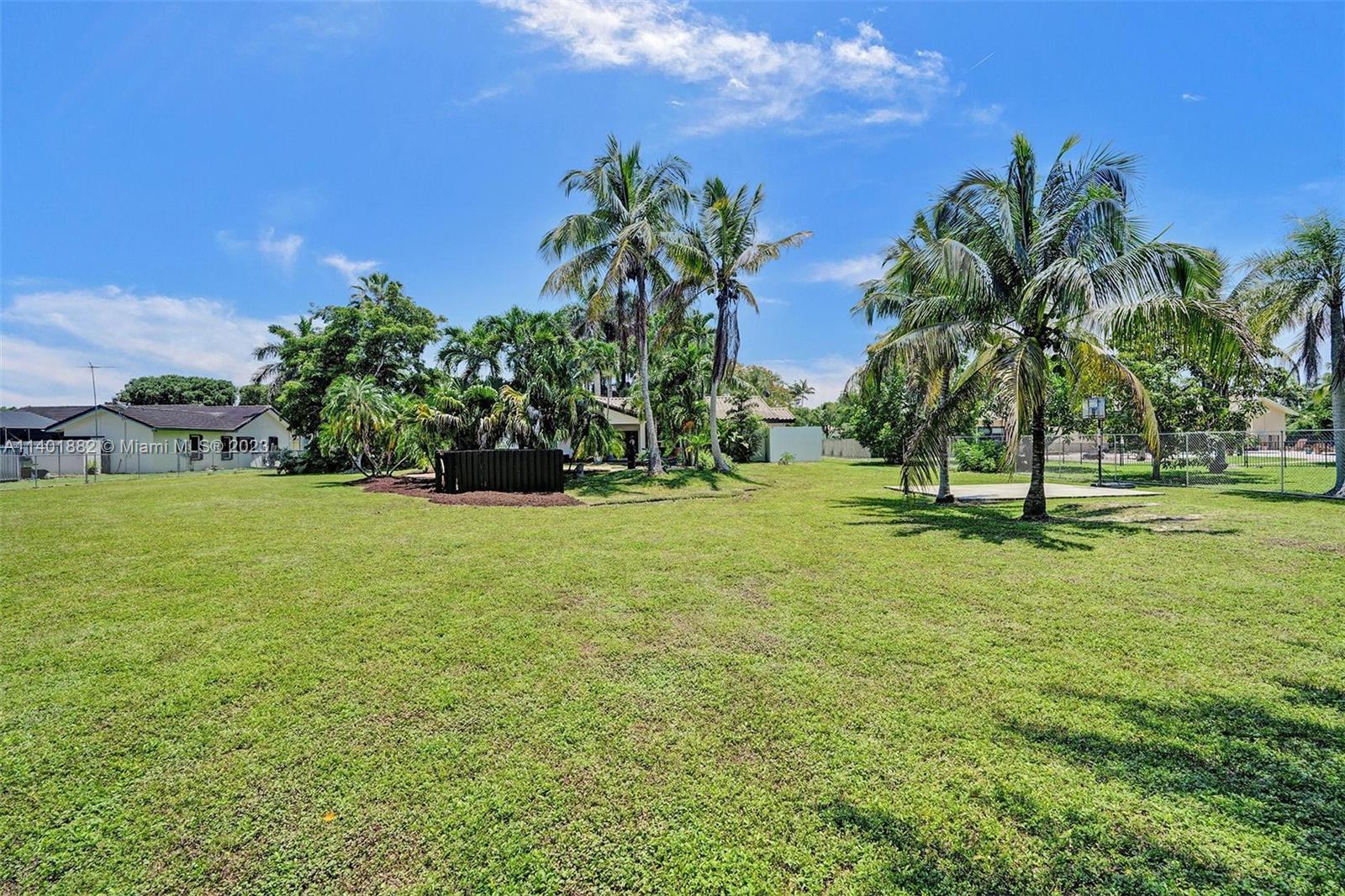 15971 Southwest 252nd Street Homestead, FL 33031 - Photo 66 of 92 a view of a yard with a house