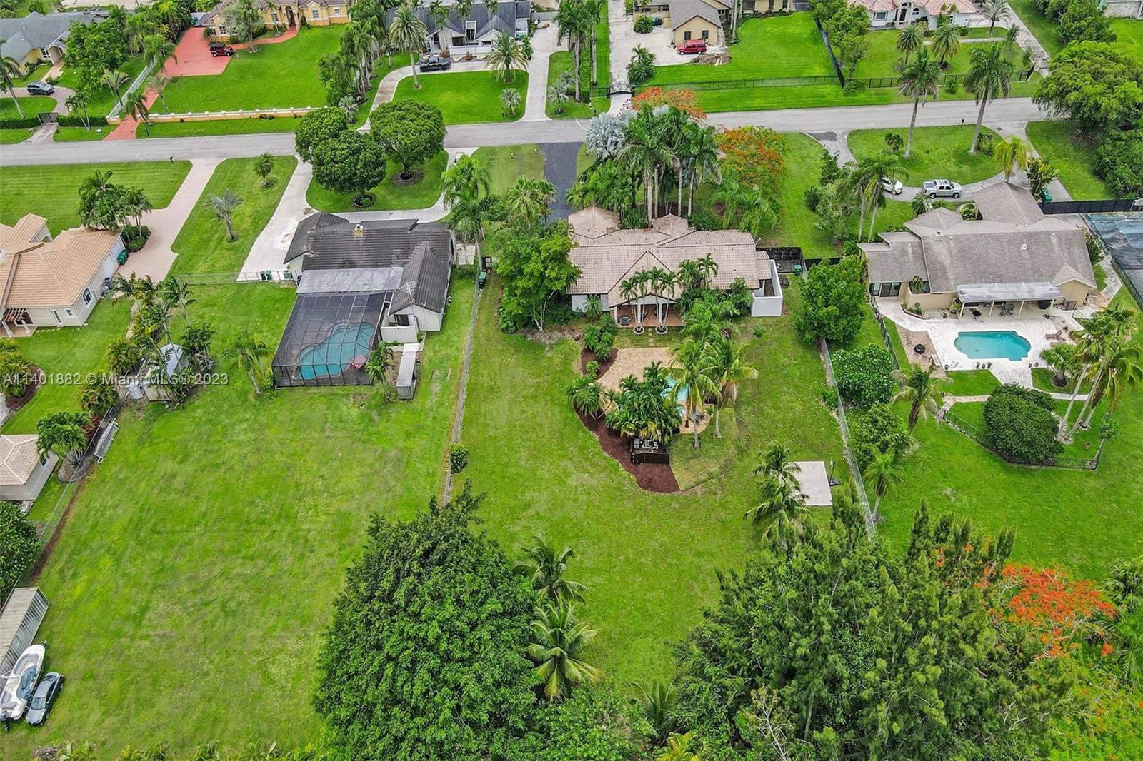 15971 Southwest 252nd Street Homestead, FL 33031 - Photo 76 of 92 an aerial view of a house with a garden