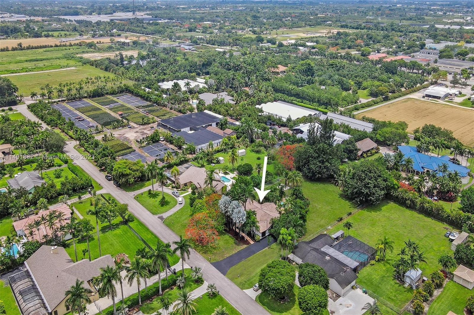 15971 Southwest 252nd Street Homestead, FL 33031 - Photo 82 of 92 an aerial view of residential houses with outdoor space and street view