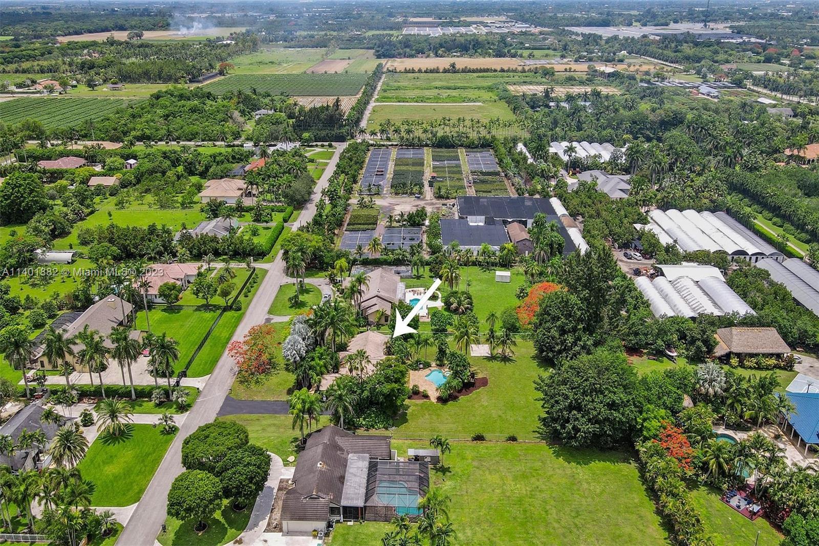 15971 Southwest 252nd Street Homestead, FL 33031 - Photo 83 of 92 an aerial view of a residential houses with outdoor space and street view