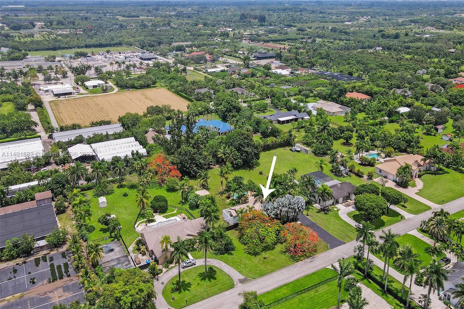15971 Southwest 252nd Street Homestead, FL 33031 - Photo 88 of 92 an aerial view of residential houses with outdoor space
