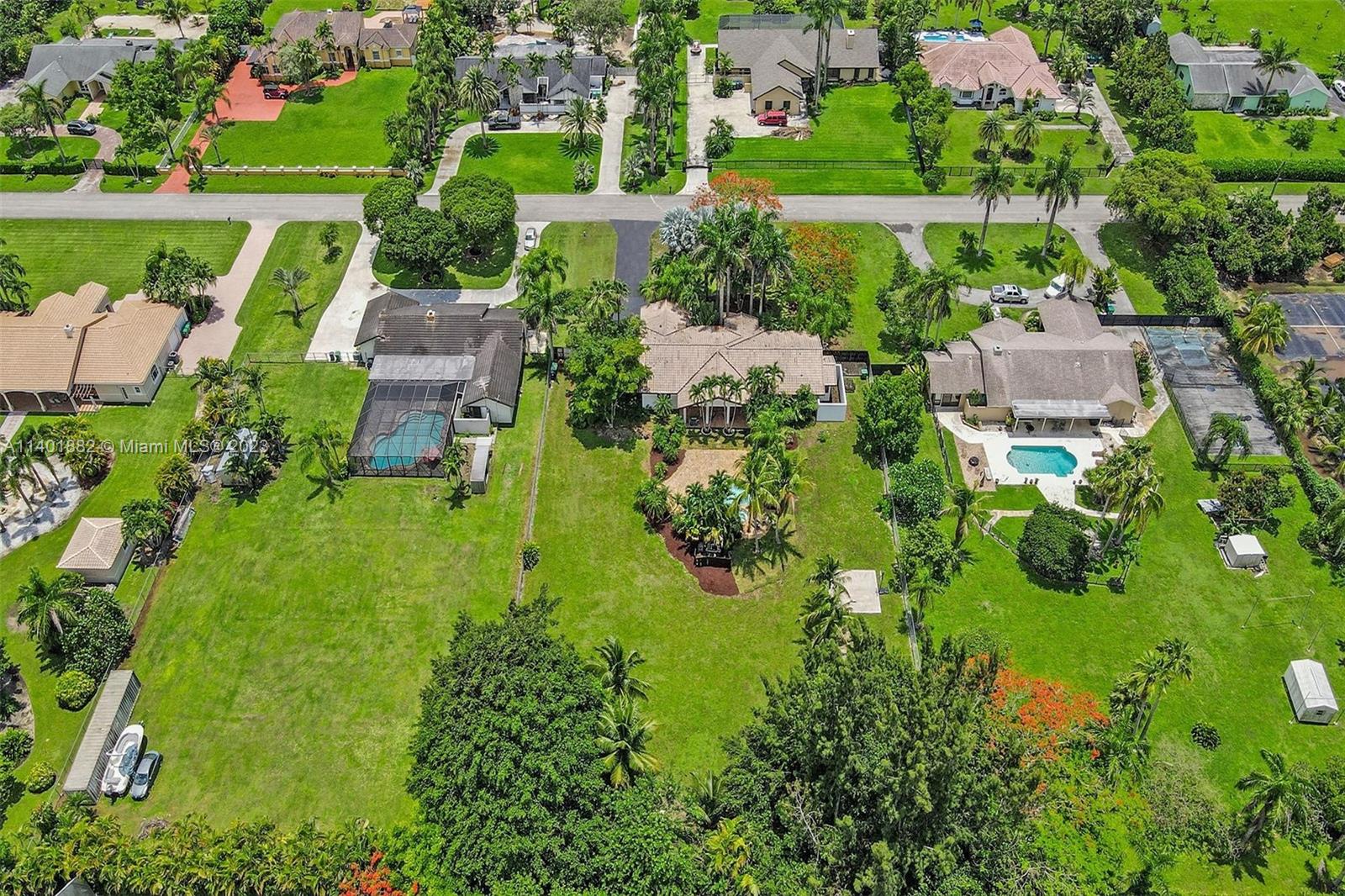 15971 Southwest 252nd Street Homestead, FL 33031 - Photo 92 of 92 an aerial view of residential house with outdoor space and swimming pool