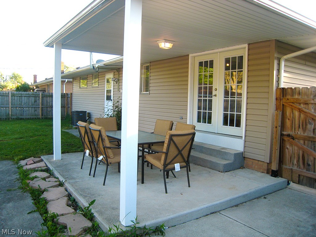 6925 Maplewood Road Parma Heights, OH 44130 - Photo 17 of 25 Private patio with 6 foot privacy fence around whole backyard. French doors lead out from dinning area.