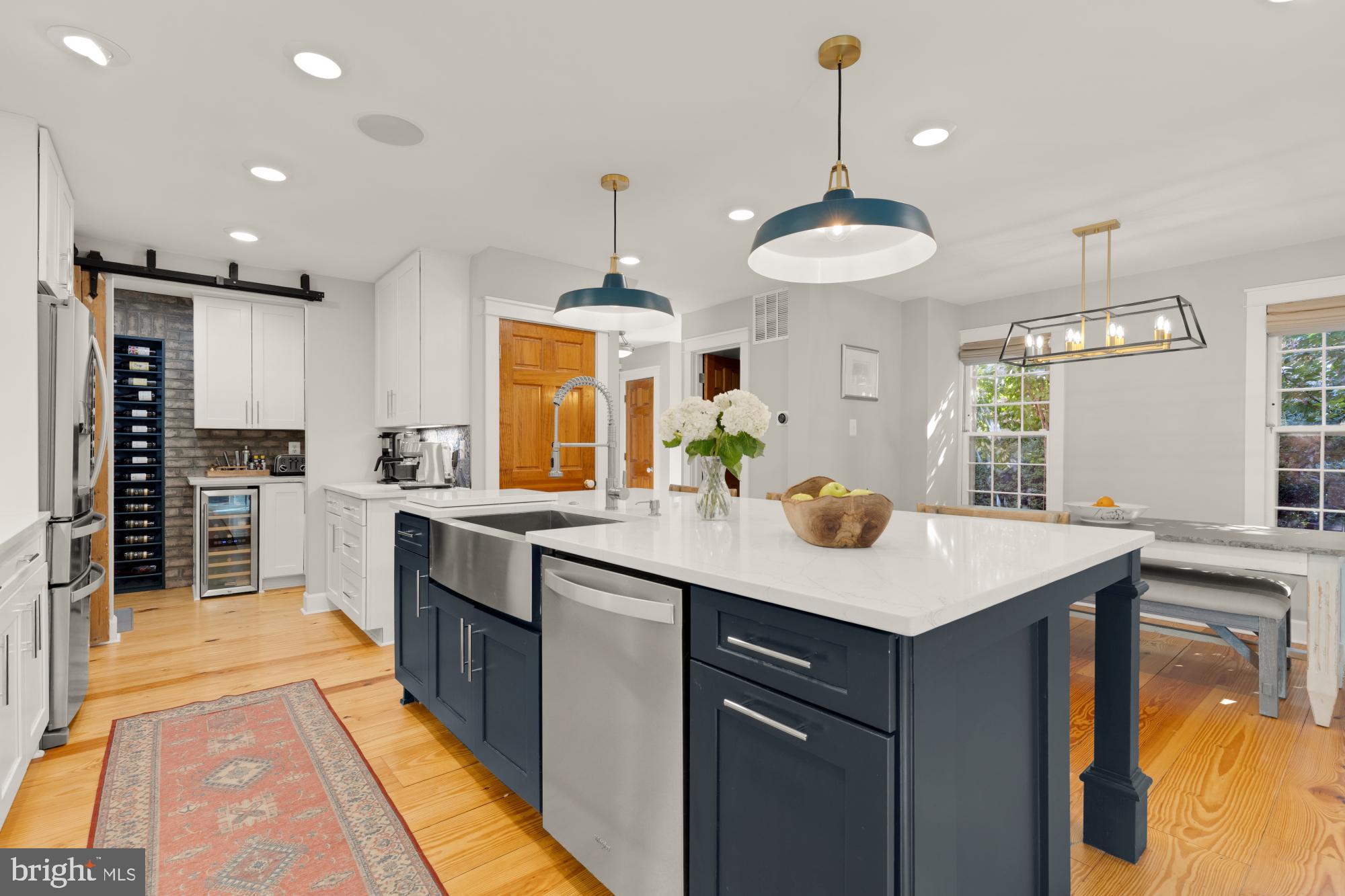 2429 Alsop Court Reston, VA 20191 - Photo 11 of 44 a kitchen with kitchen island granite countertop a sink a counter top space and stainless steel appliances