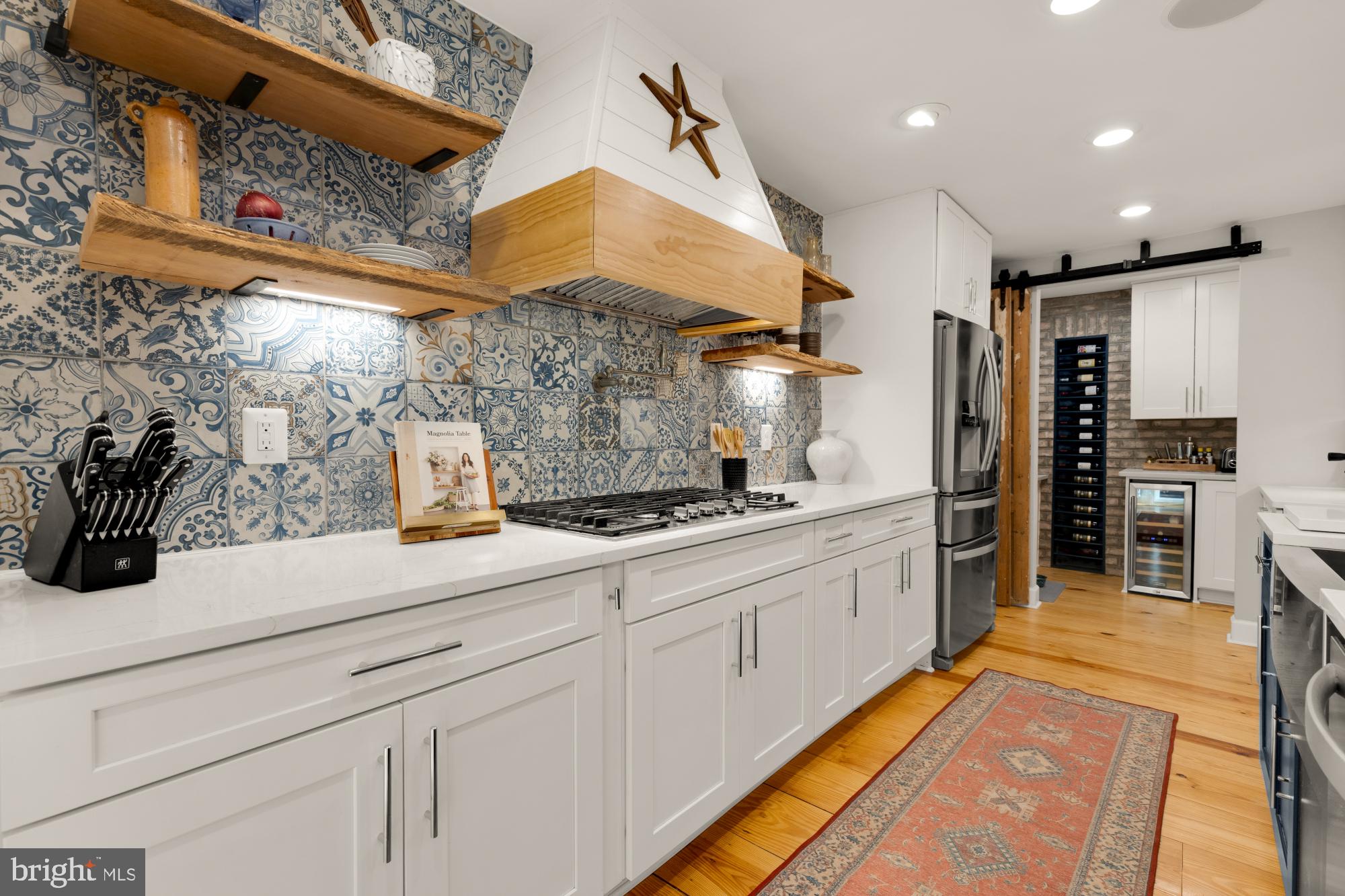 2429 Alsop Court Reston, VA 20191 - Photo 12 of 44 a kitchen with stainless steel appliances kitchen island granite countertop a sink and cabinets