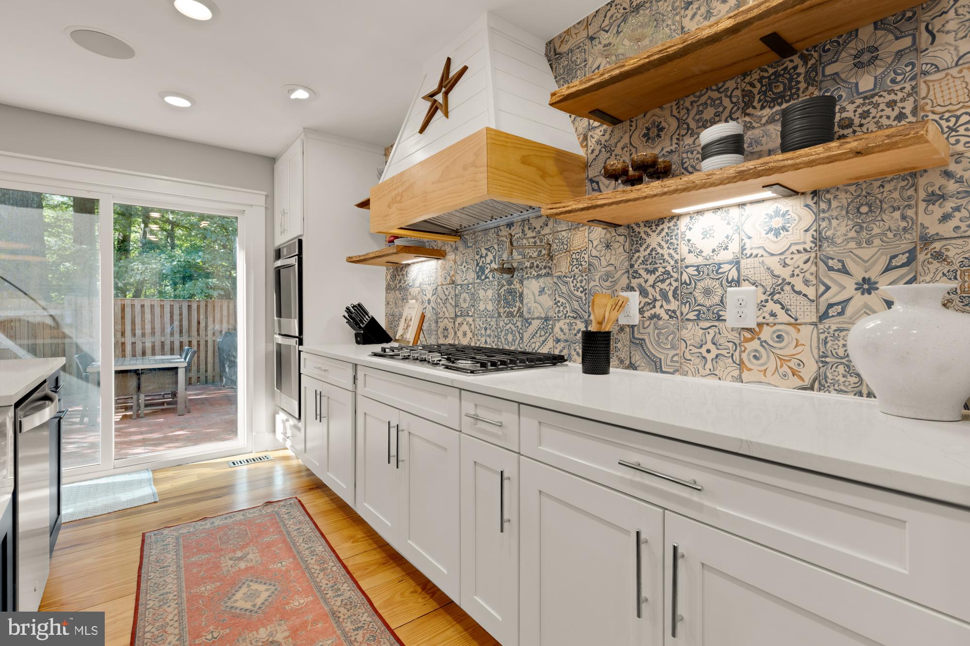 2429 Alsop Court Reston, VA 20191 - Photo 14 of 44 a kitchen with white cabinets and window