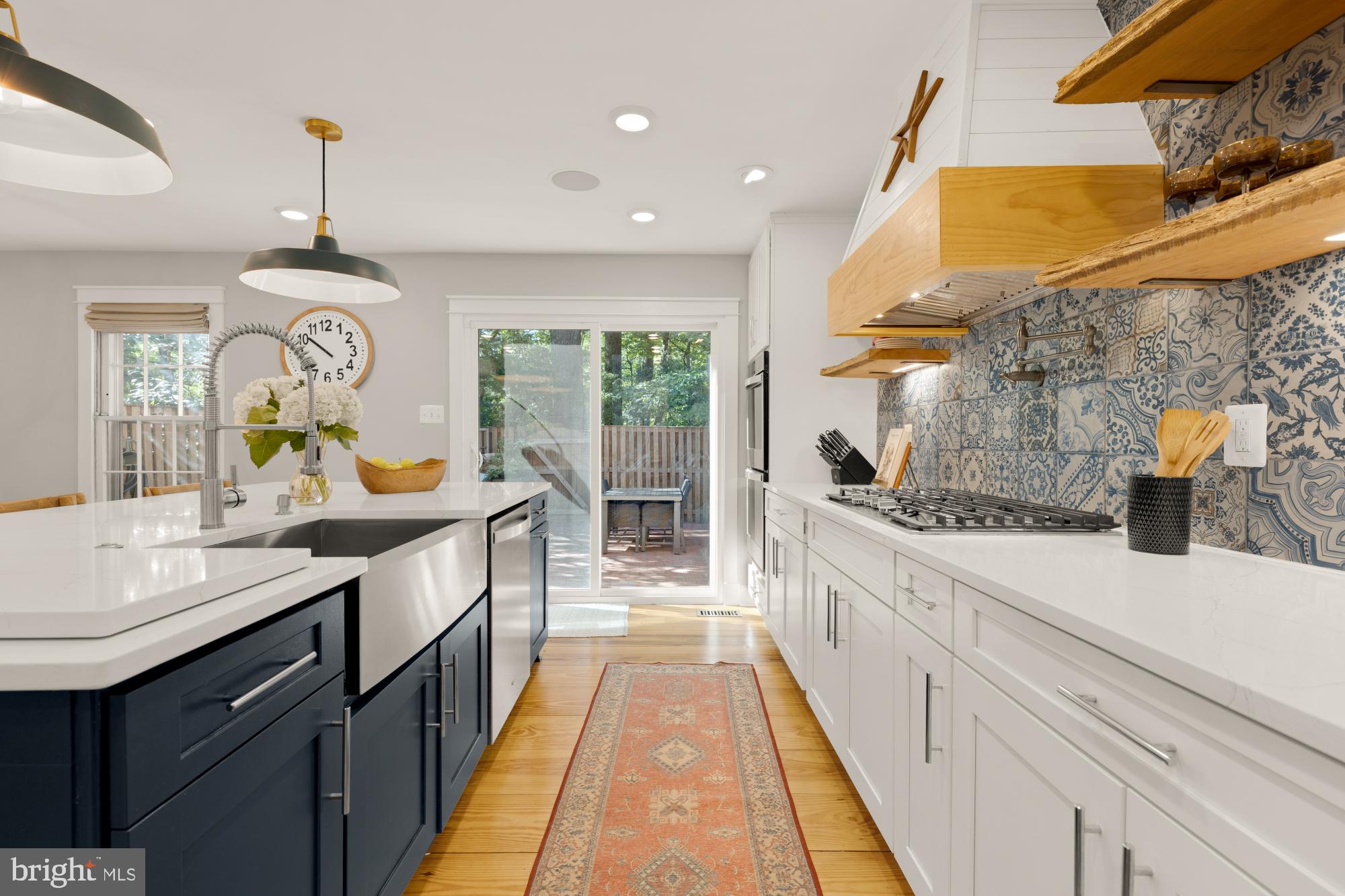 2429 Alsop Court Reston, VA 20191 - Photo 15 of 44 a large kitchen with granite countertop a sink and a refrigerator