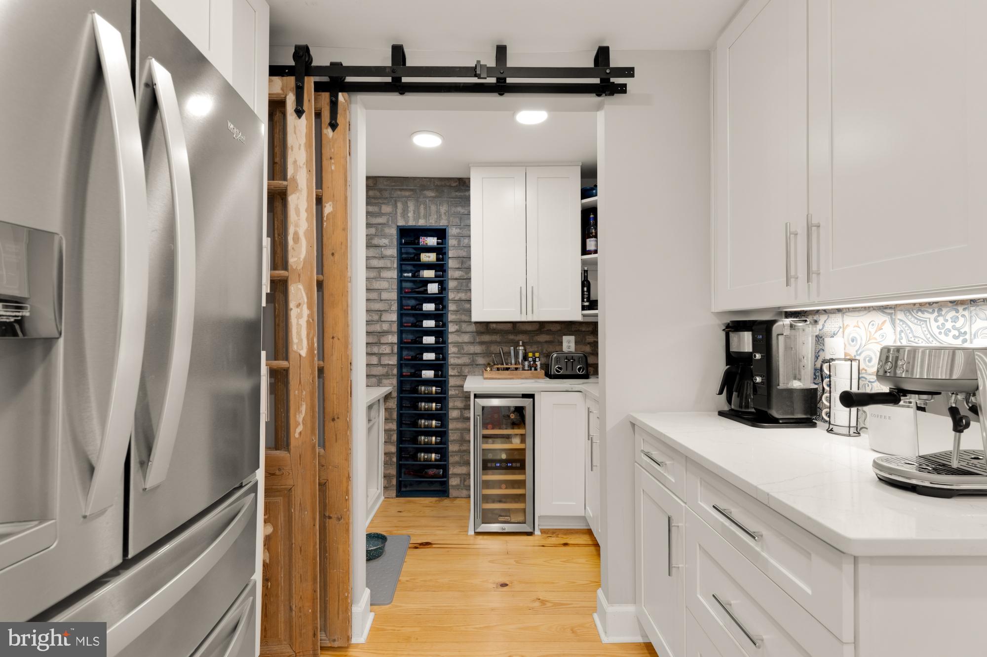 2429 Alsop Court Reston, VA 20191 - Photo 18 of 44 a kitchen with stainless steel appliances a refrigerator and cabinets