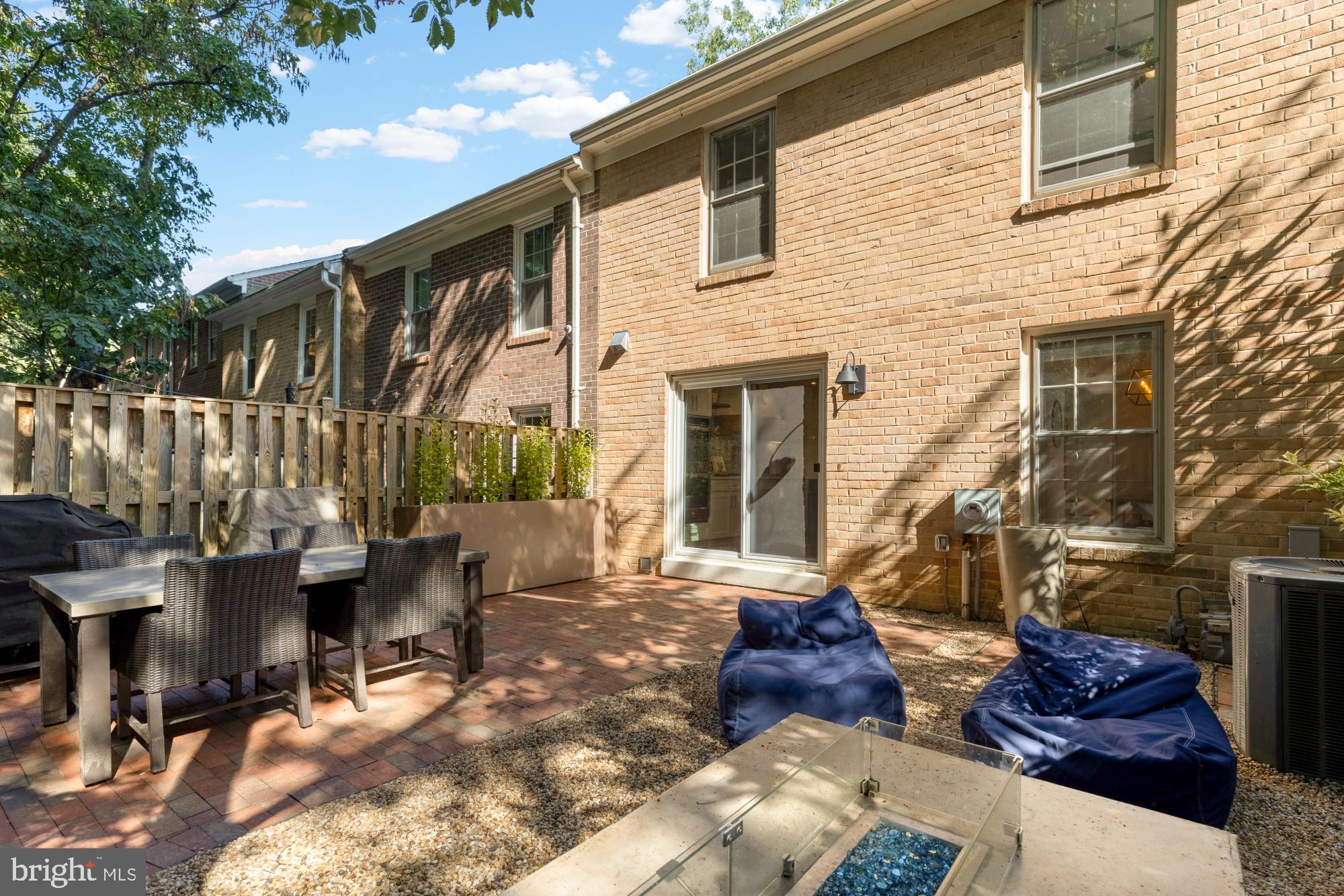 2429 Alsop Court Reston, VA 20191 - Photo 22 of 44 a view of two chairs and table in backyard of the house