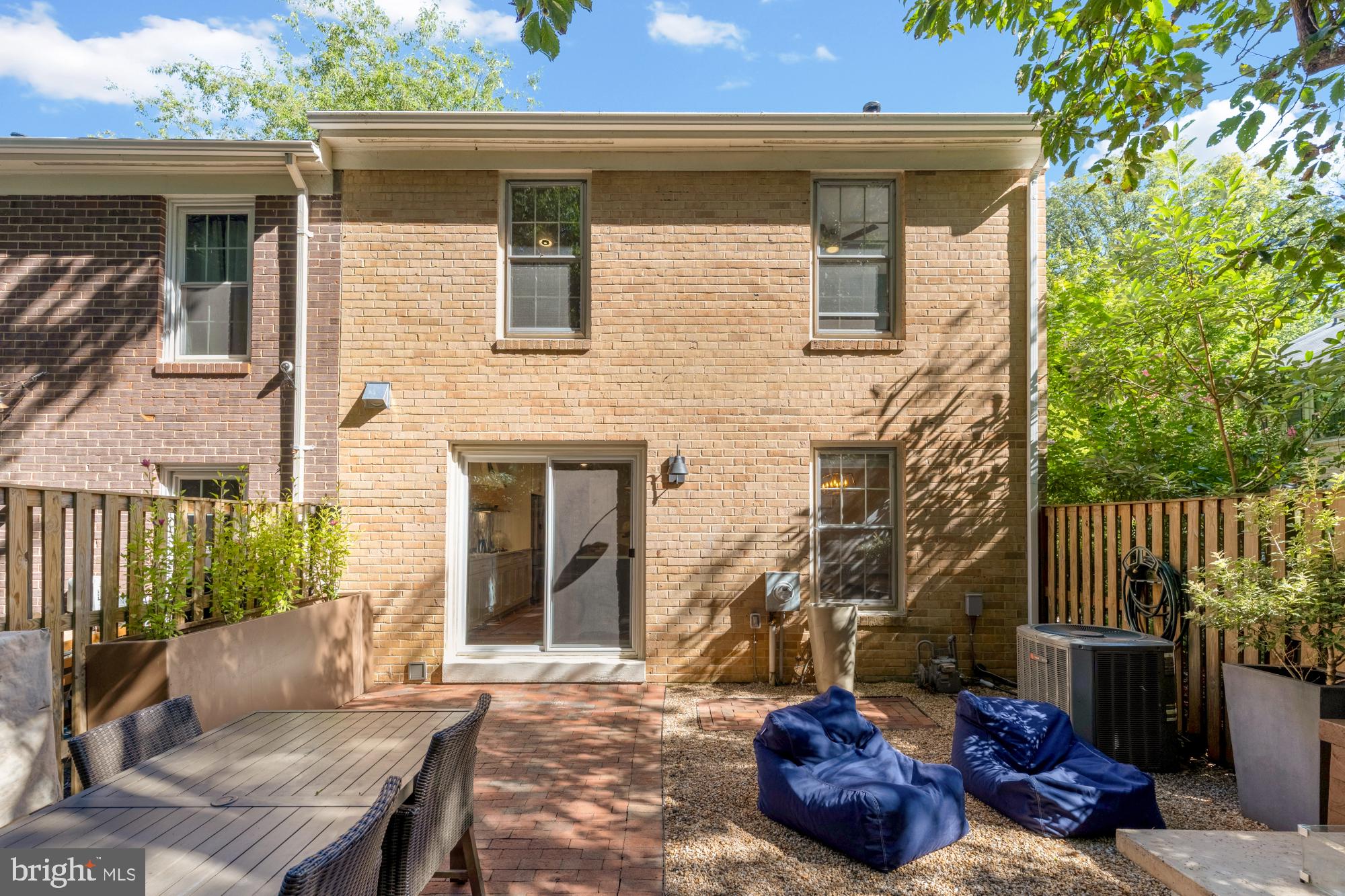 2429 Alsop Court Reston, VA 20191 - Photo 23 of 44 a view of a house with a chairs and table in a patio