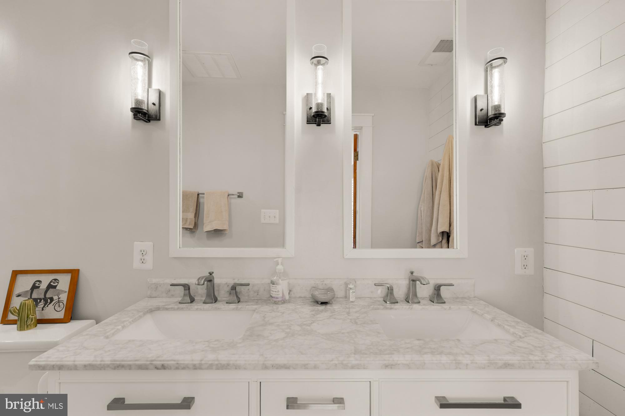 2429 Alsop Court Reston, VA 20191 - Photo 30 of 44 a bathroom with a granite countertop sink and a mirror