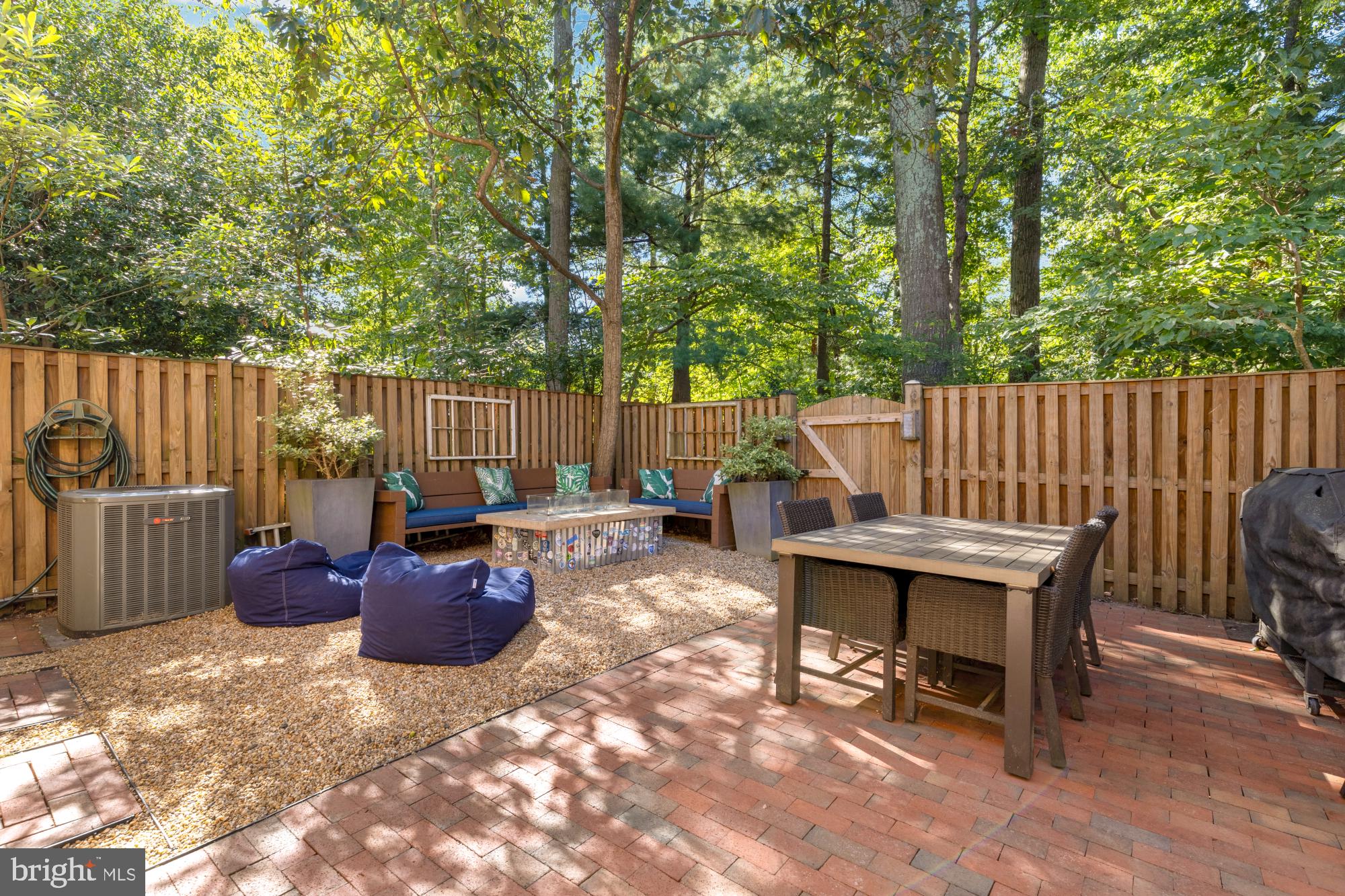 2429 Alsop Court Reston, VA 20191 - Photo 3 of 44 a view of a patio with table and chairs potted plants and large tree