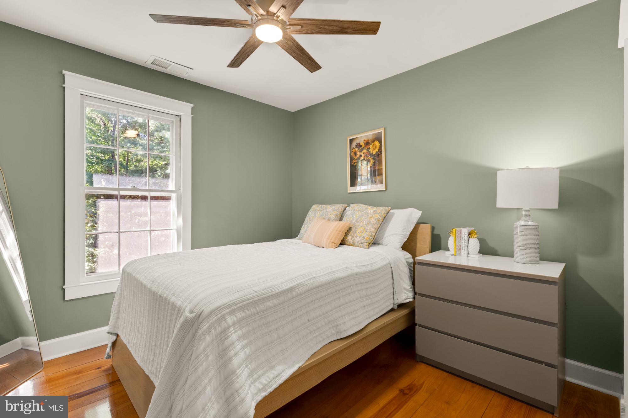 2429 Alsop Court Reston, VA 20191 - Photo 32 of 44 a bedroom with a bed and a chandelier