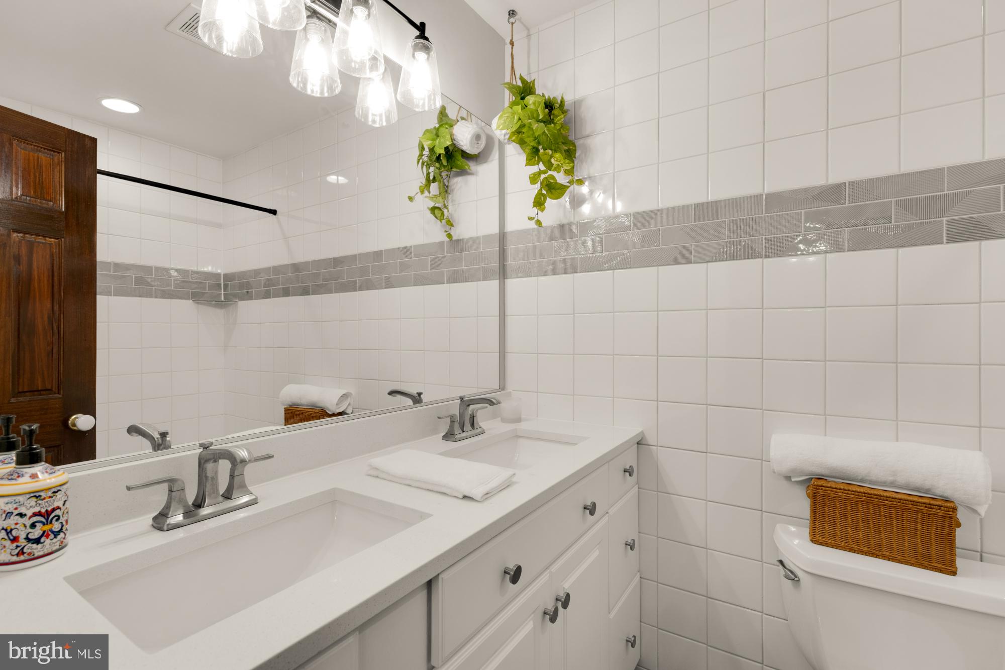 2429 Alsop Court Reston, VA 20191 - Photo 35 of 44 a bathroom with a sink and a mirror