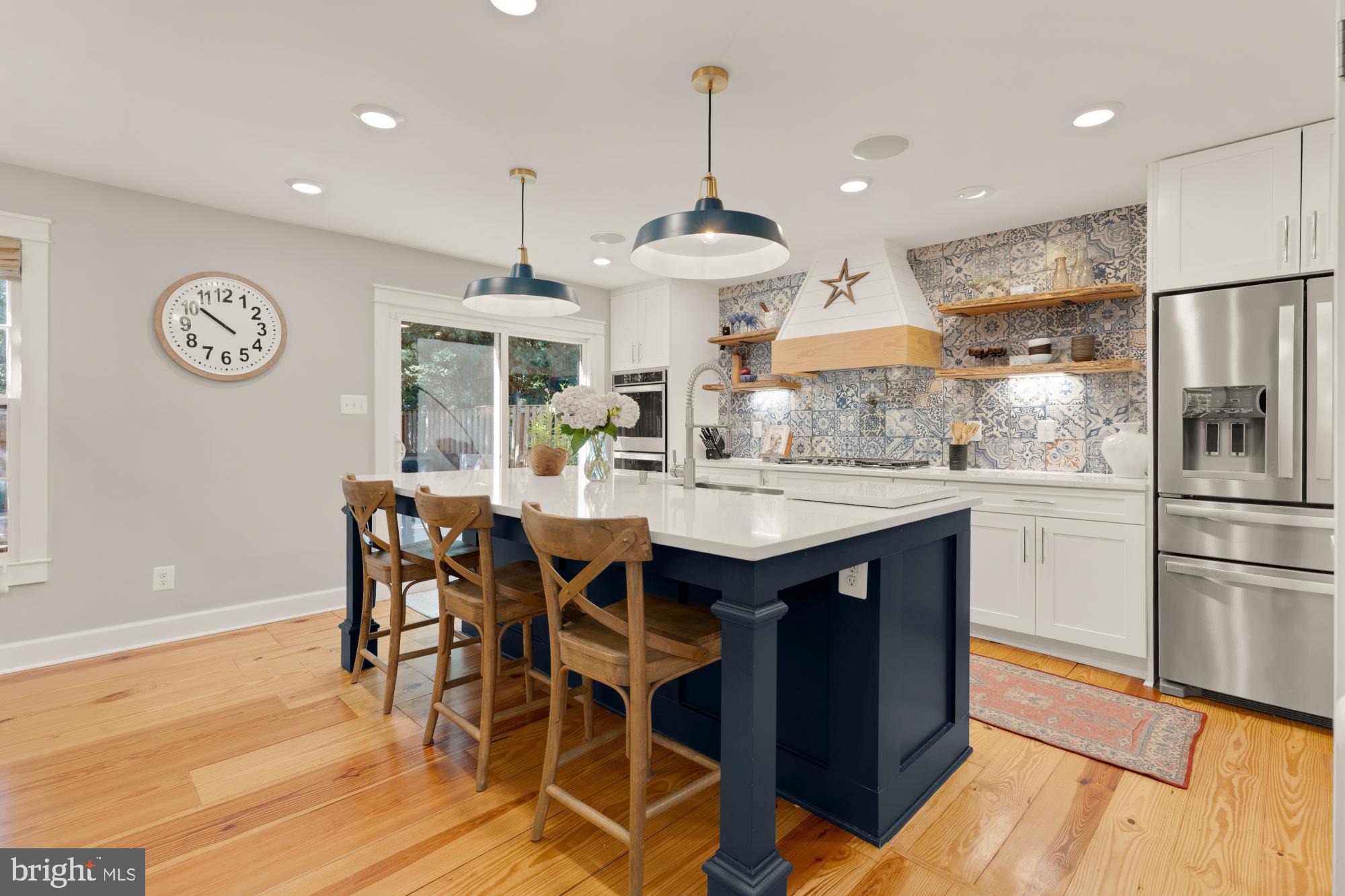 2429 Alsop Court Reston, VA 20191 - Photo 8 of 44 a kitchen with stainless steel appliances a dining table chairs and wooden floor