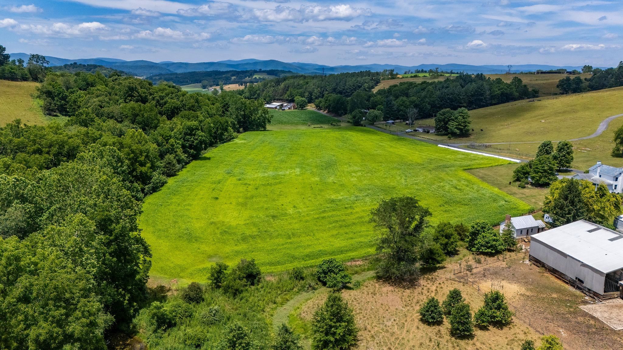 1748 Moffett Branch Road Churchville, VA 24421 - Photo 4 of 53 a view of a lake with a building in the background