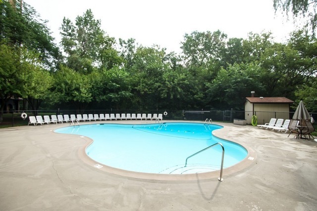 1 Renaissance Place, Unit 1106 Palatine, IL 60067 - Photo 13 of 15 a view of a swimming pool with a chair and tables