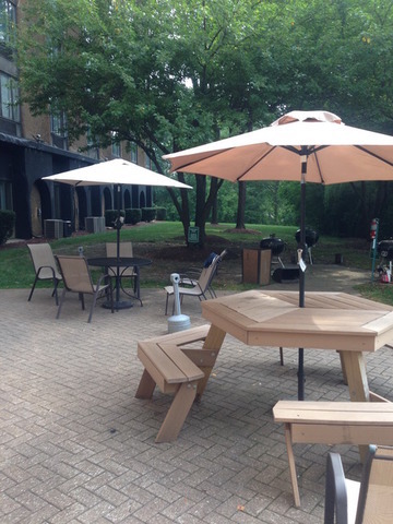 1 Renaissance Place, Unit 1106 Palatine, IL 60067 - Photo 15 of 15 a swimming pool with table and chairs under an umbrella