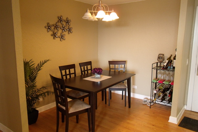 1 Renaissance Place, Unit 1106 Palatine, IL 60067 - Photo 4 of 15 a view of a dining room with furniture and wooden floor