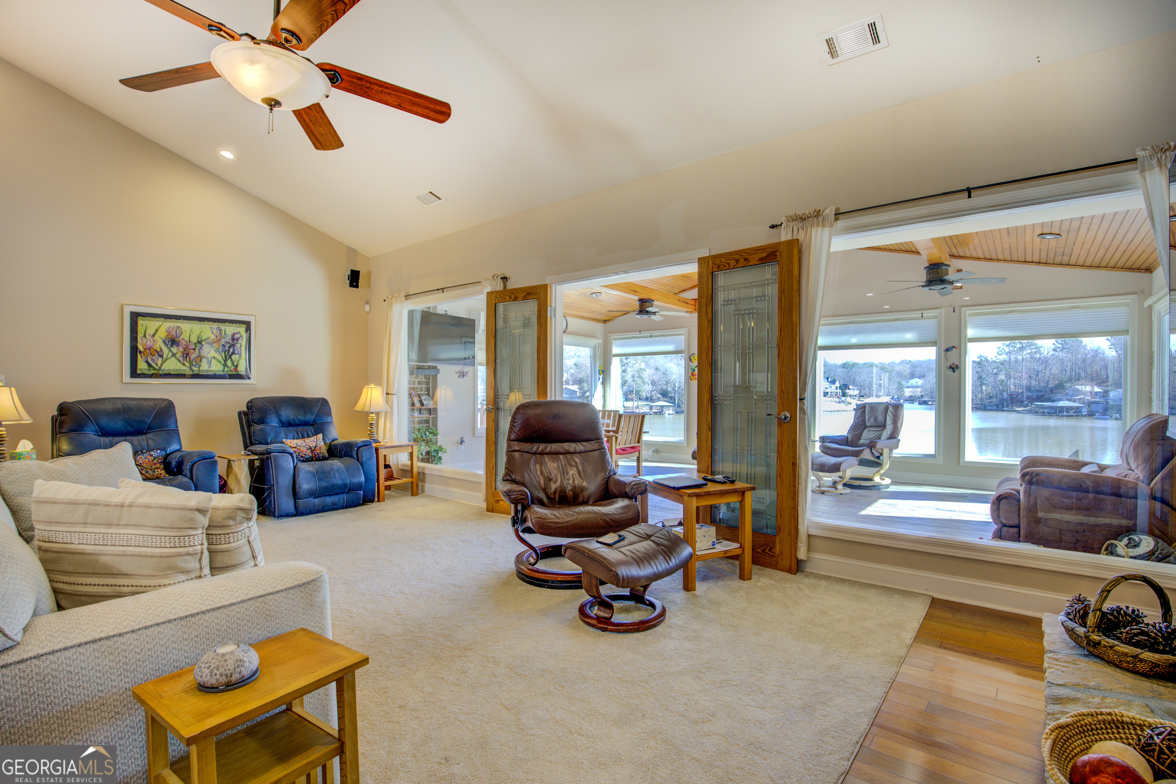 921 Yancey Road Covington, GA 30014 - Photo 23 of 85 a living room with furniture gym equipment and a large window