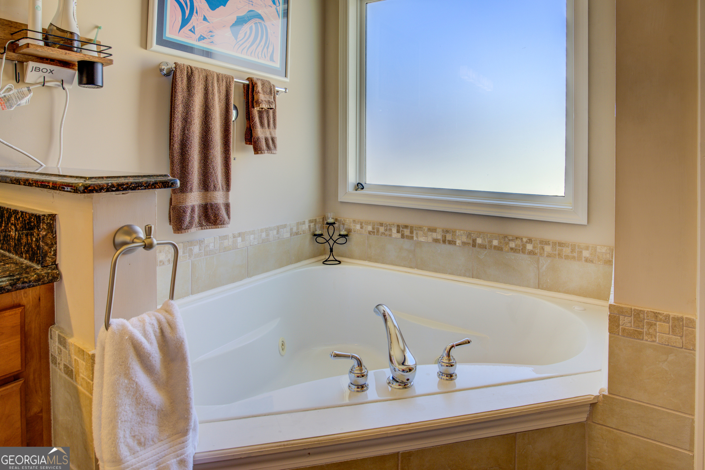 921 Yancey Road Covington, GA 30014 - Photo 37 of 85 a bathroom with a tub and a sink