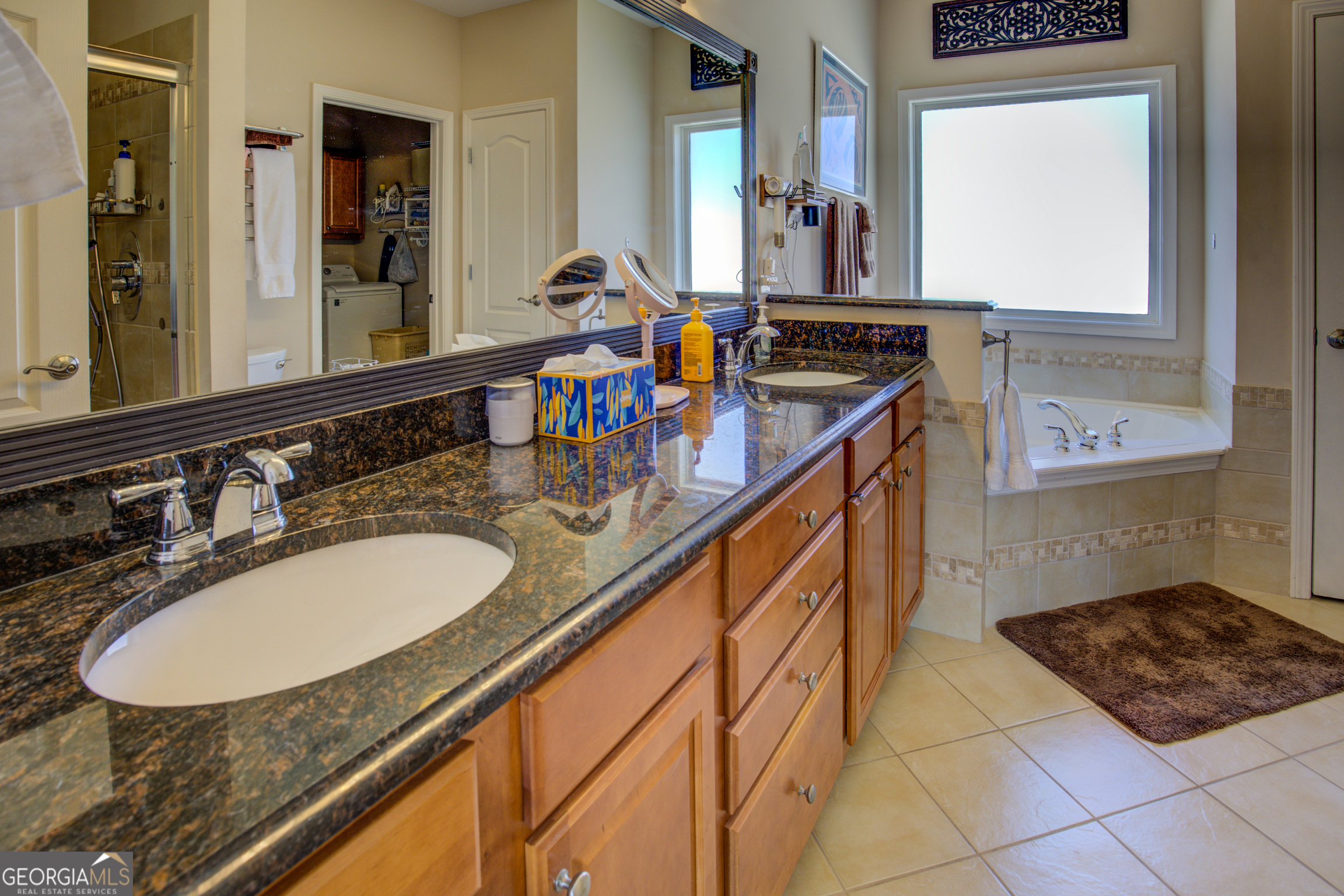 921 Yancey Road Covington, GA 30014 - Photo 39 of 85 a bathroom with sink and mirror