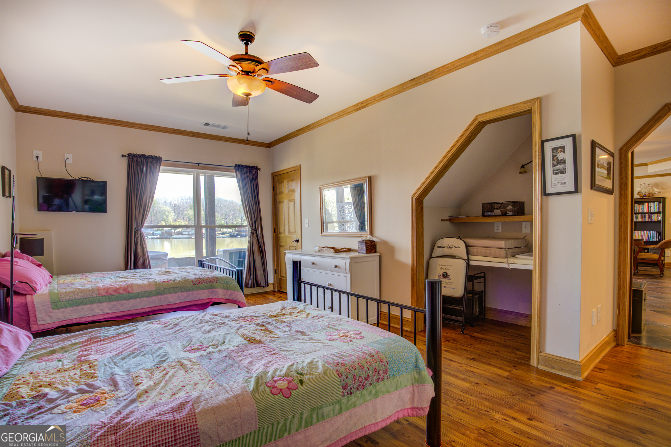 921 Yancey Road Covington, GA 30014 - Photo 49 of 85 a bedroom with a bed and wooden floor