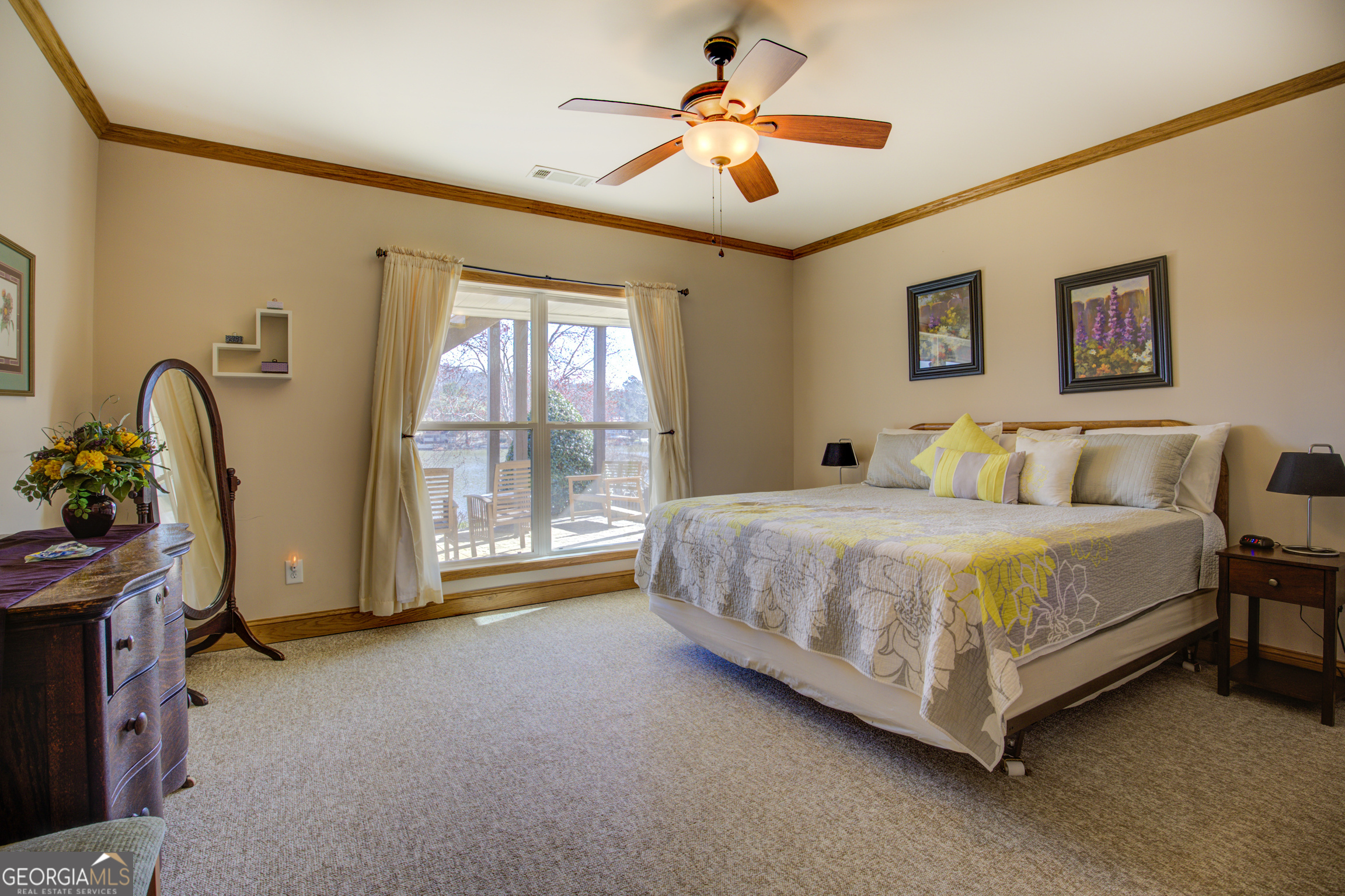 921 Yancey Road Covington, GA 30014 - Photo 57 of 85 a spacious bedroom with a bed a window and potted plant