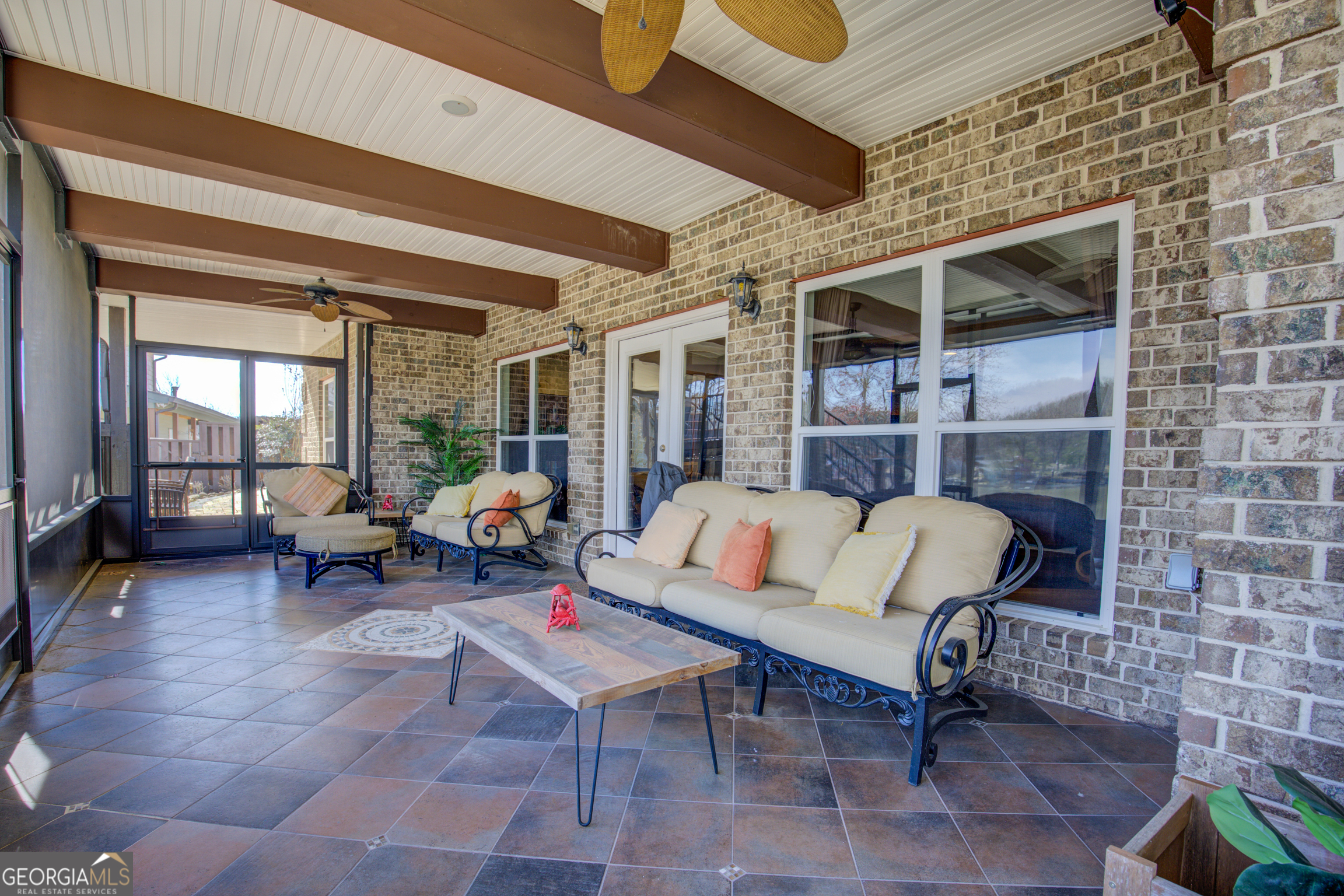 921 Yancey Road Covington, GA 30014 - Photo 67 of 85 a outdoor living space with furniture and a fireplace