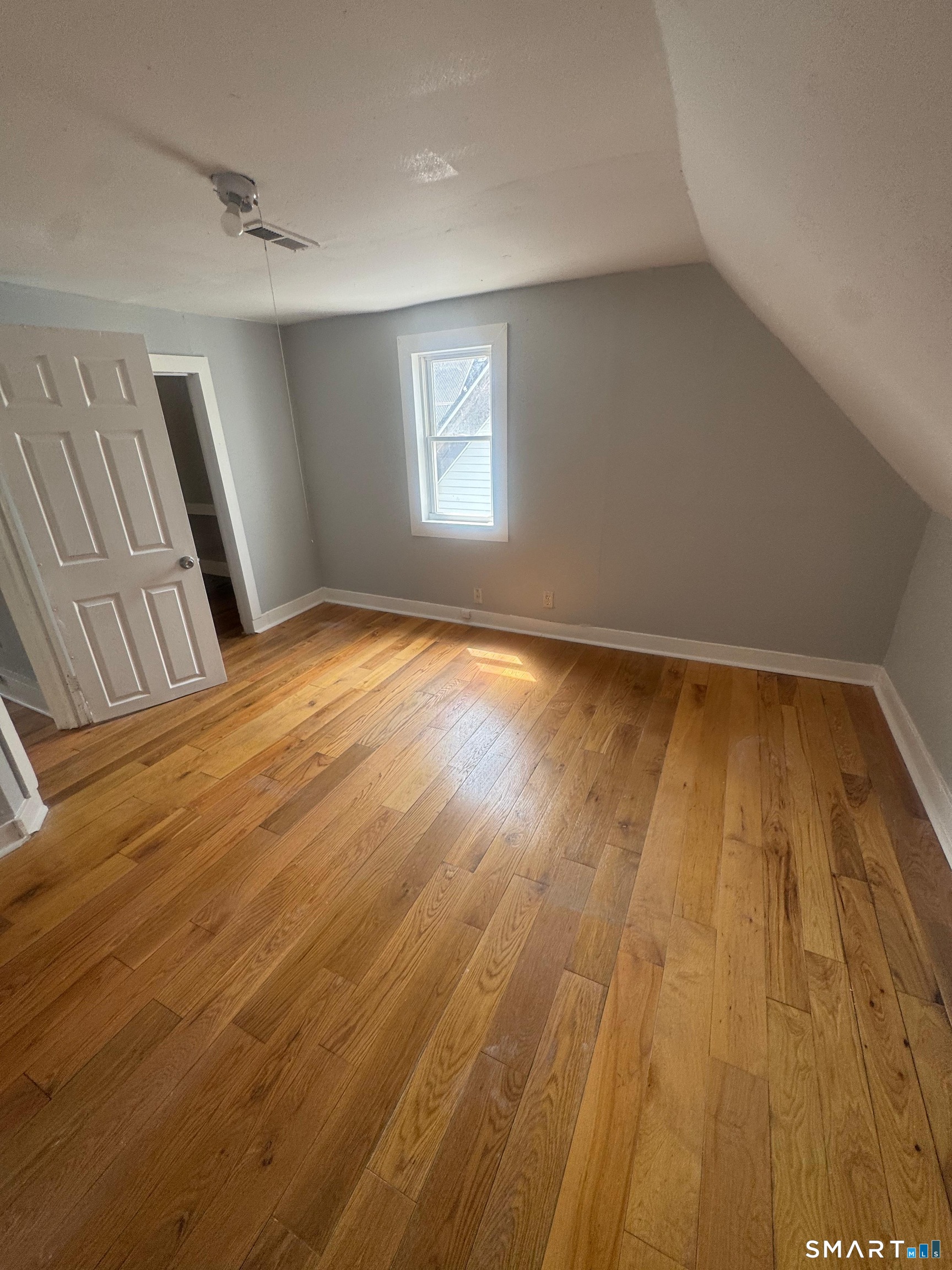 7 Armstrong Place Bridgeport, CT 06608 - Photo 6 of 9 a view of an empty room and wooden floor