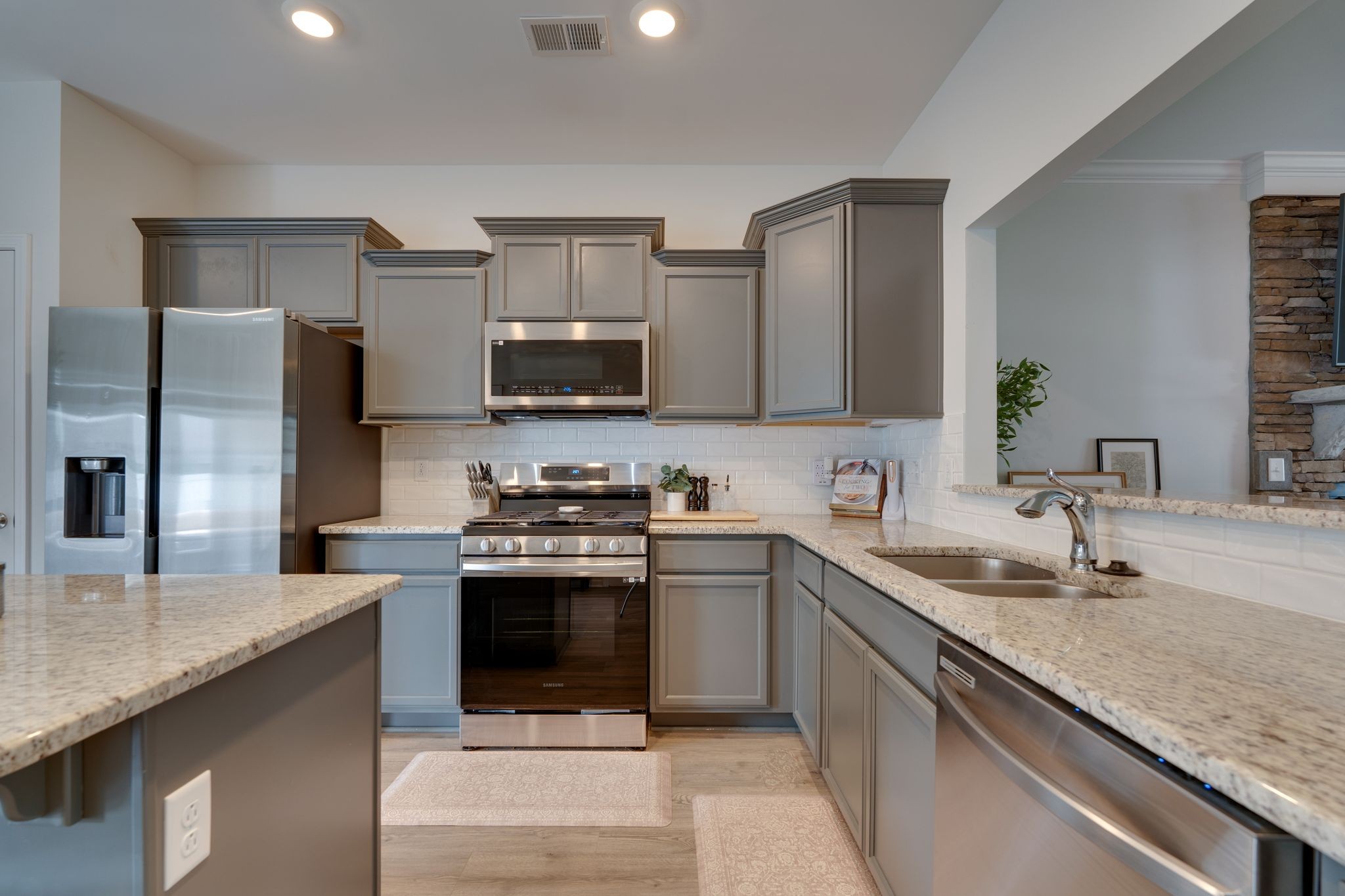 3229 Chatfield Drive Murfreesboro, TN 37129 - Photo 11 of 26 a kitchen with stainless steel appliances granite countertop a sink stove and refrigerator