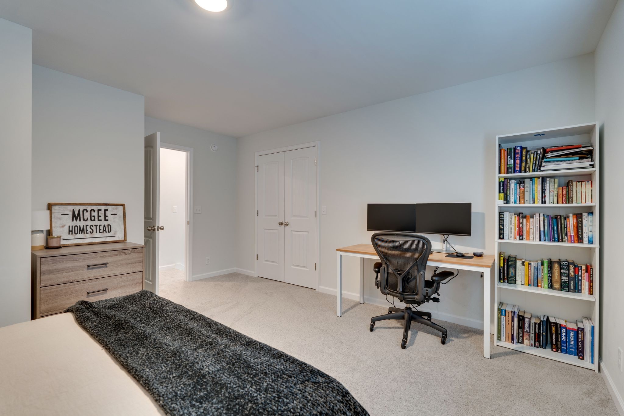 3229 Chatfield Drive Murfreesboro, TN 37129 - Photo 18 of 26 a bedroom with a bed and a book shelf
