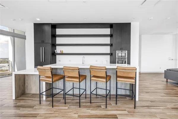 a view of a kitchen with electric appliances