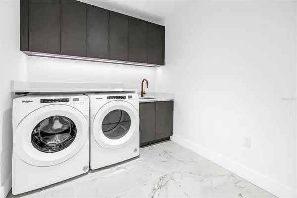 a view of cabinets and a sink
