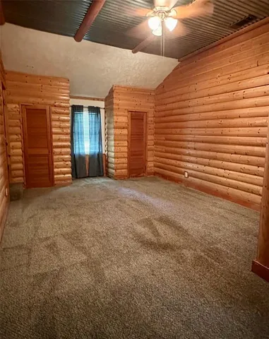 a bathroom with a toilet sink vanity tub and shower