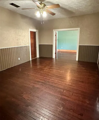 a kitchen with stainless steel appliances granite countertop a sink a stove and cabinets