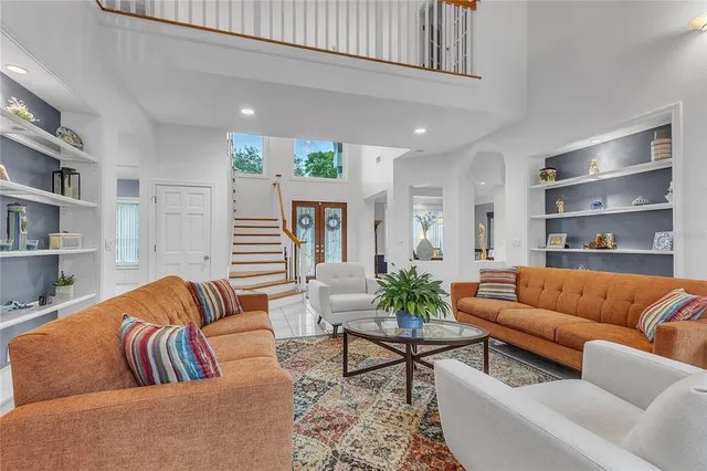 a living room with furniture and a large window