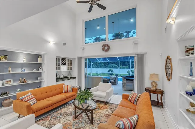 a kitchen with stainless steel appliances wooden cabinets a stove a sink and a large window