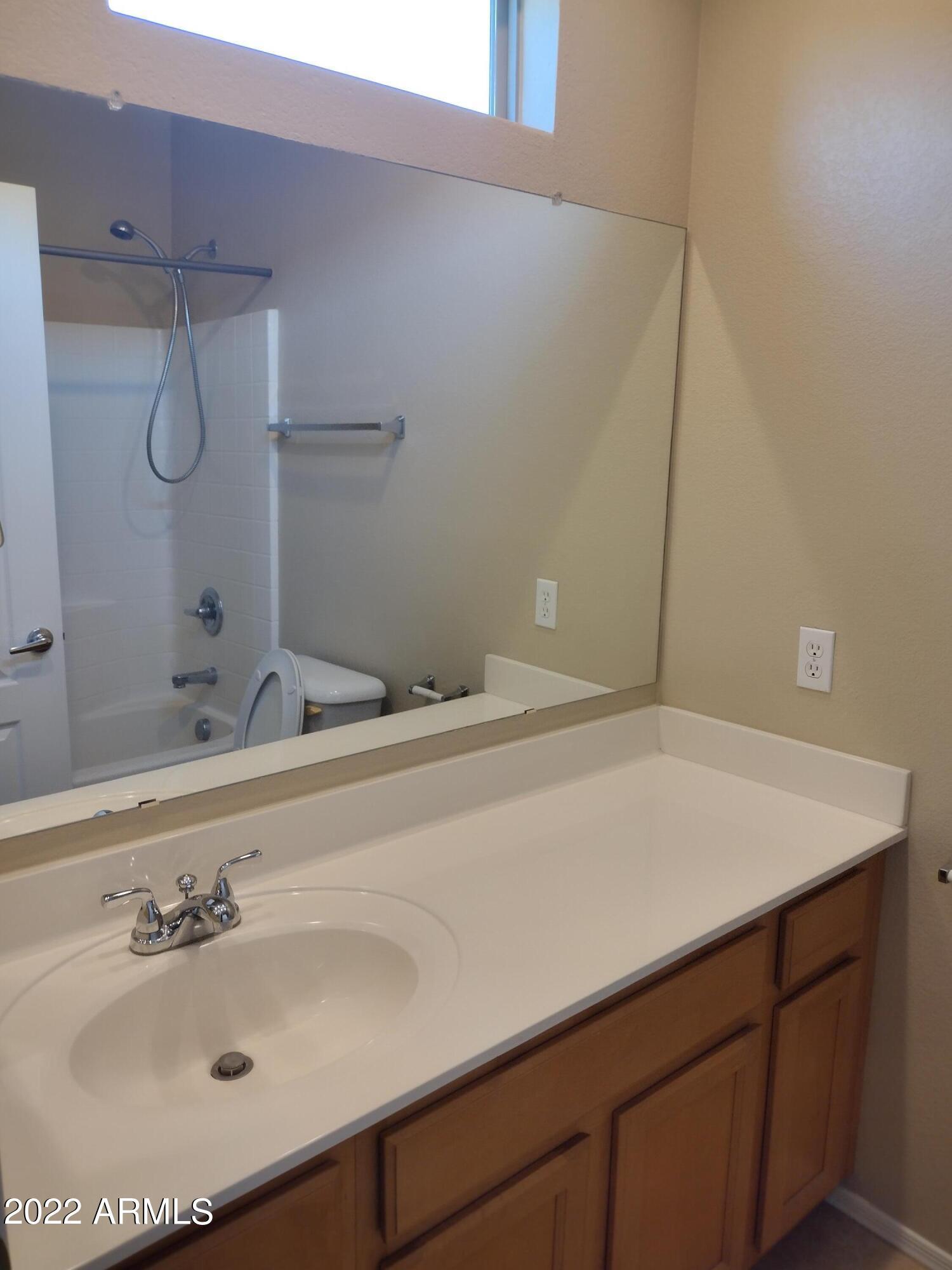 2401 East Rio Salado Parkway, Unit 1076 Tempe, AZ 85288 - Photo 9 of 15 a bathroom with a sink and a mirror