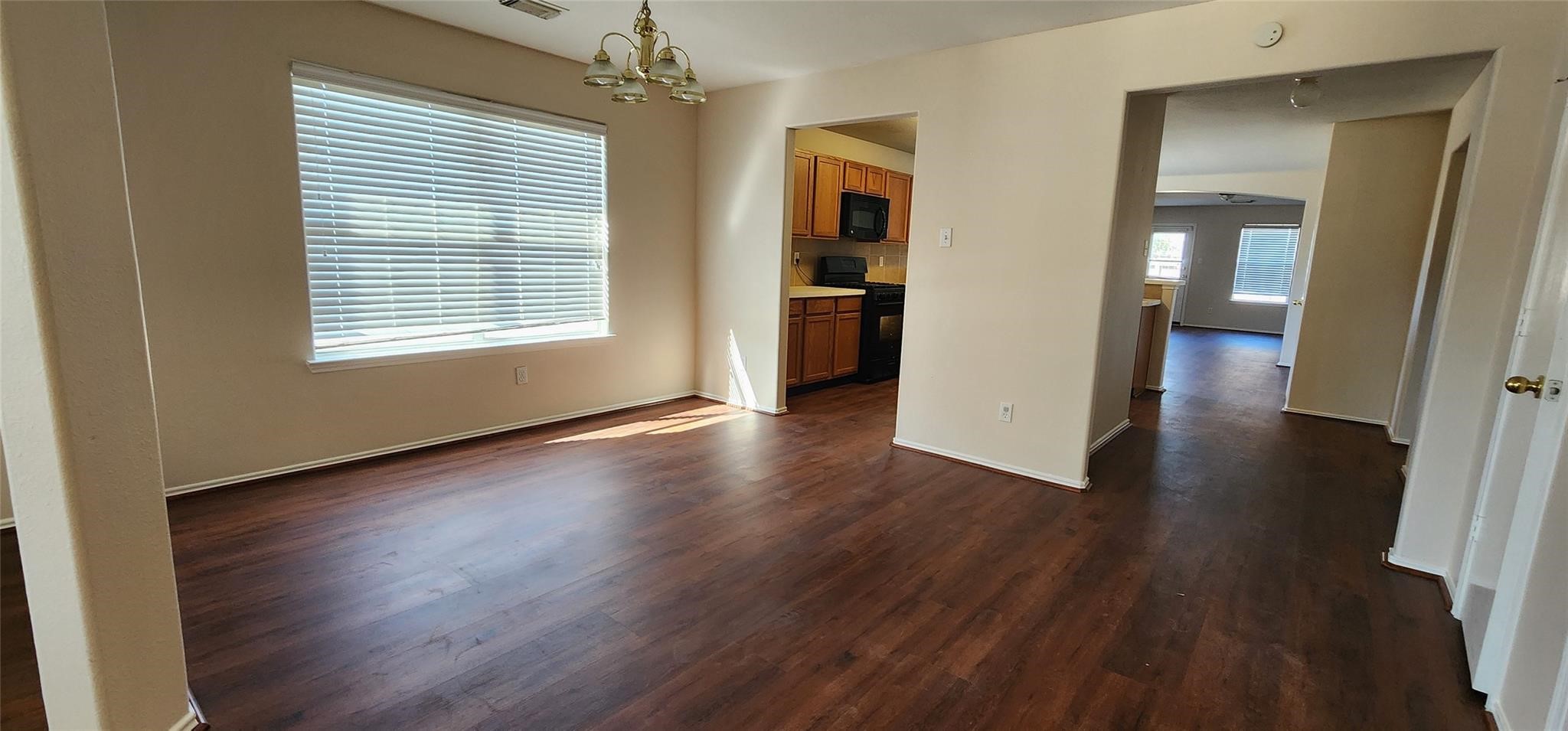315 Sunset Colony Drive Rosharon, TX 77583 - Photo 3 of 20 a view of a room with wooden floor and windows