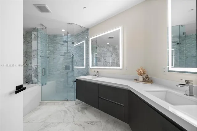 a bathroom with a tub sink and mirror