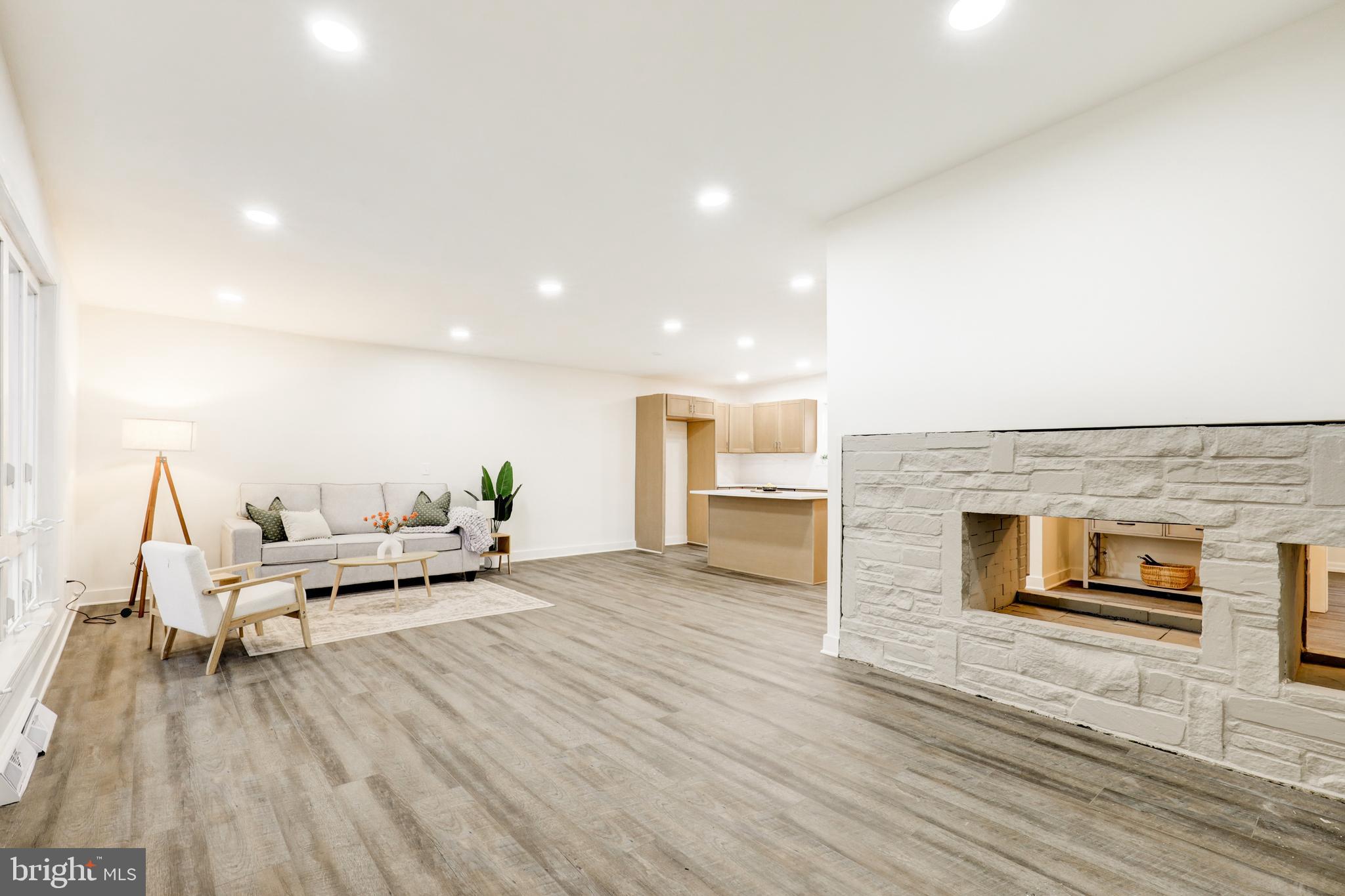 904 South Chester Road West Chester, PA 19382 - Photo 14 of 47 a living room with furniture and a fireplace