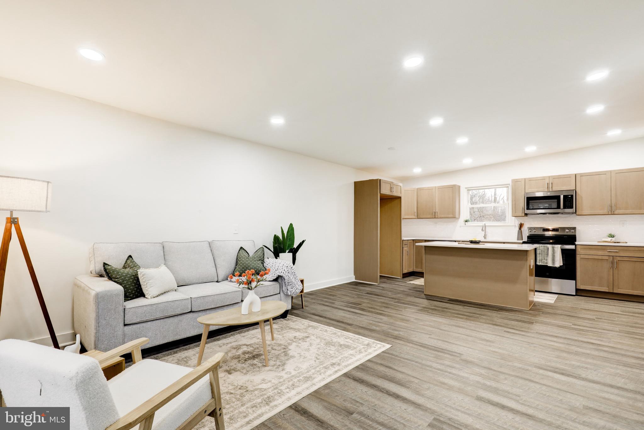 904 South Chester Road West Chester, PA 19382 - Photo 15 of 47 a living room with furniture and kitchen view with wooden floor