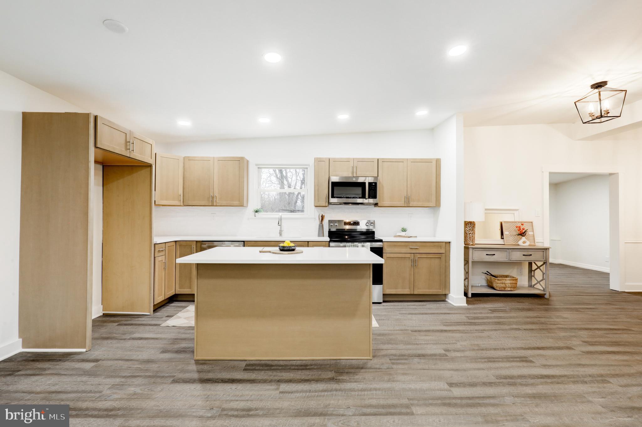 904 South Chester Road West Chester, PA 19382 - Photo 18 of 47 a view of kitchen with microwave stove refrigerator and cabinets