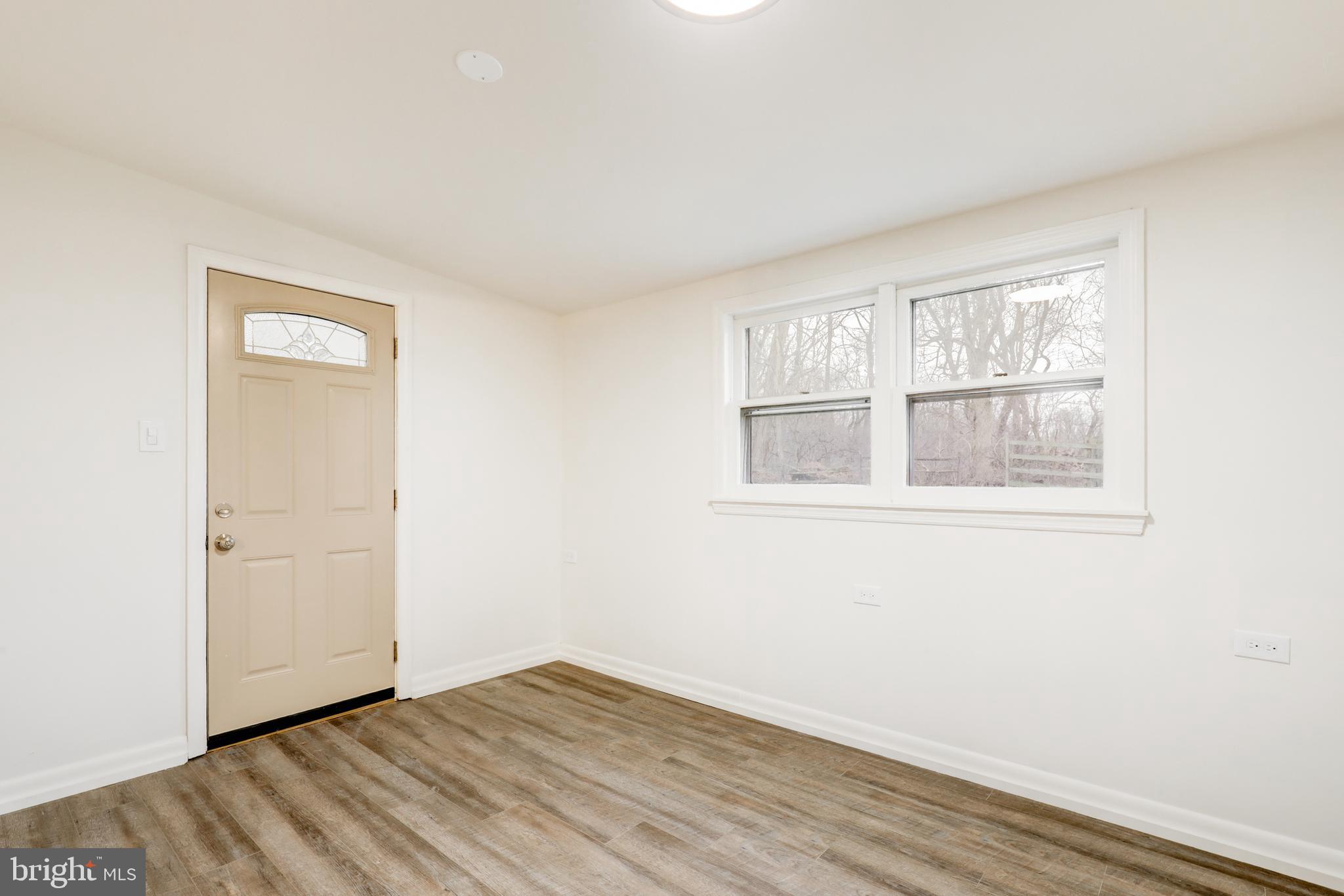 904 South Chester Road West Chester, PA 19382 - Photo 30 of 47 a view of an empty room with wooden floor and a window