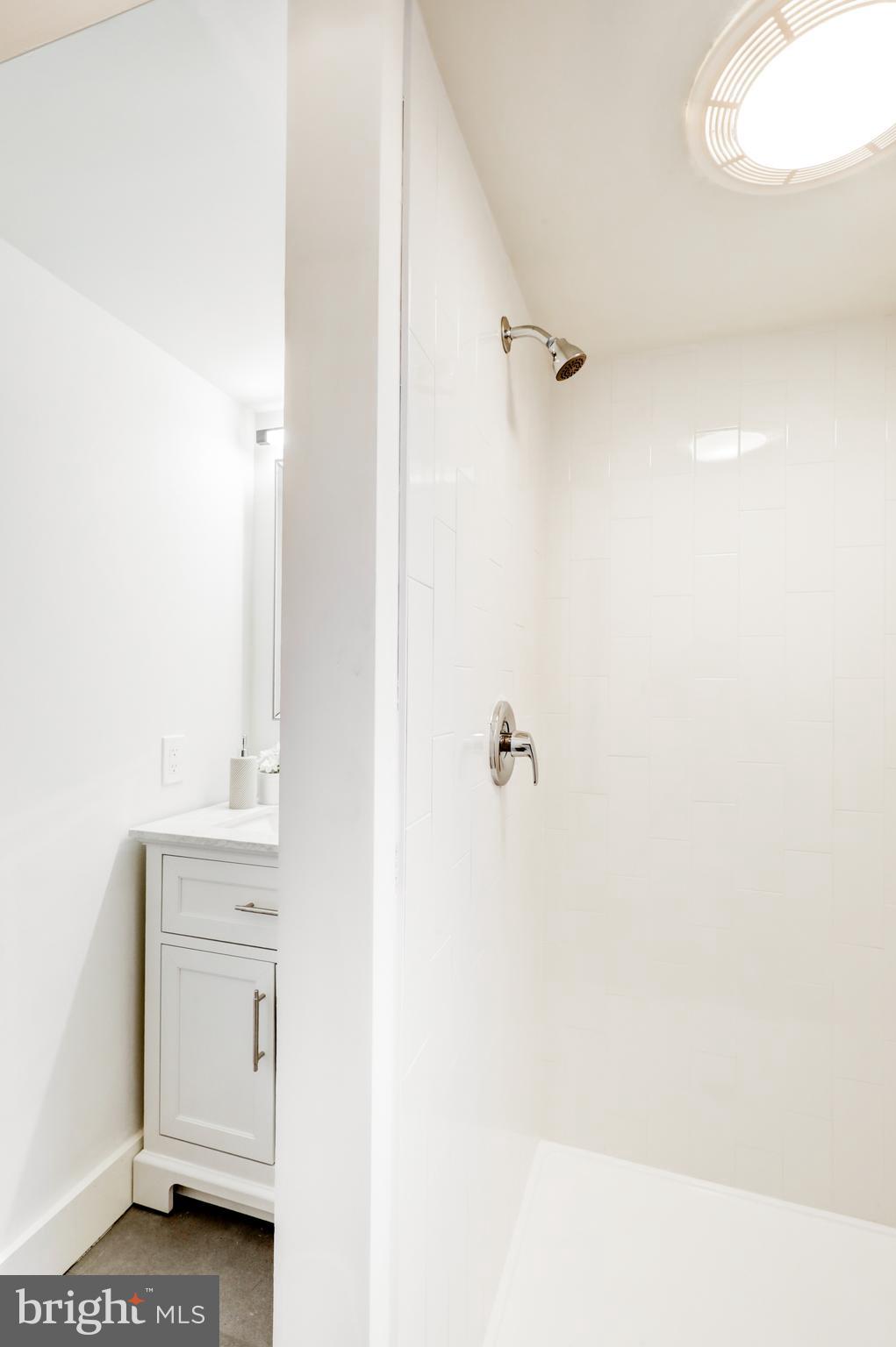 904 South Chester Road West Chester, PA 19382 - Photo 36 of 47 a bathroom with a bathtub sink vanity and mirror
