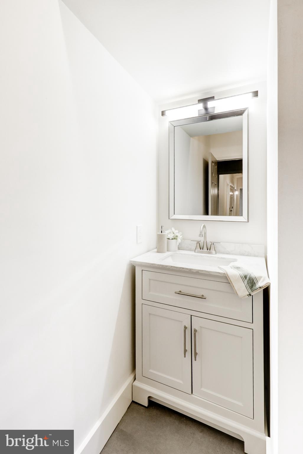 904 South Chester Road West Chester, PA 19382 - Photo 37 of 47 a bathroom with a sink and a mirror